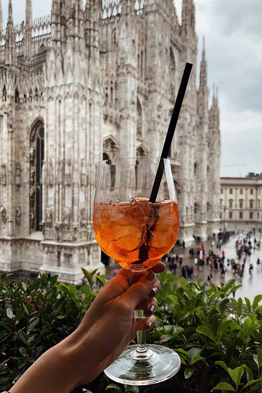 View of the Duomo Cathedral in Milan from Terrazza Aperol, the perfect spot for an aperitif with a panorama of historic architecture.