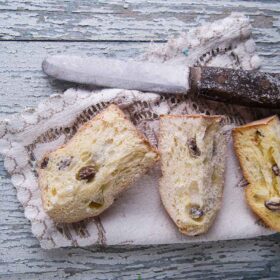 Traditional Italian panettone, cut into pieces, a Christmas dessert