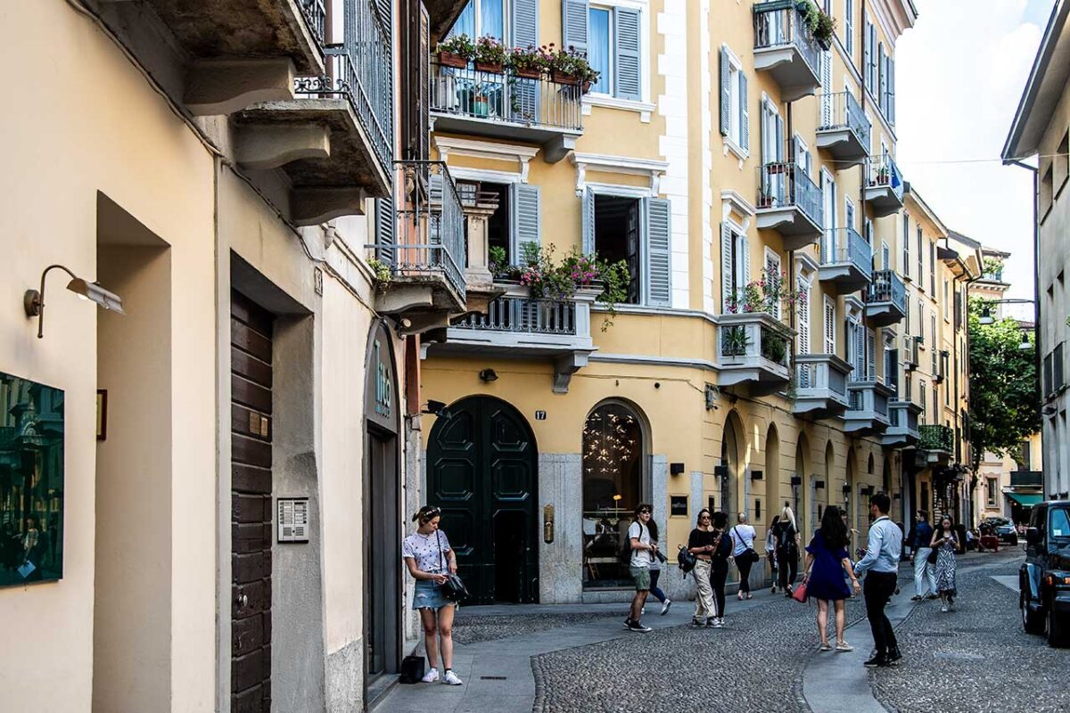 Yellow tenement houses and cobbled streets in Brera 