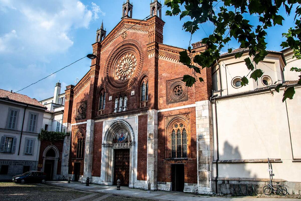 The red brick facade of St. Mark's Church in Milan