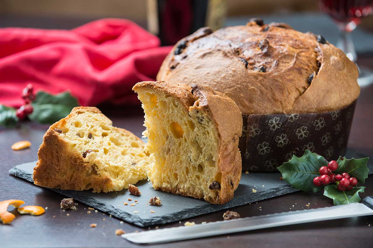 Pieces of traditional Panettone with candied fruit, perfect for buying at a Milanese pastry shop for Christmas.